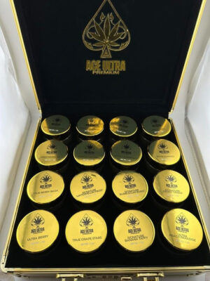 Ace Ultra Crumble 1oz concentrate box packaging and clear storage jar displaying golden wax 28g