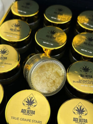 Ace Ultra Crumble 1oz concentrate box packaging and clear storage jar displaying golden wax 28g