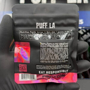 Puff LA Edibles 1000mg THC Cluster Gummies packaging display showing Strawberry Blueberry and Grape flavors