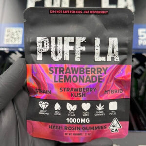 Puff LA Edibles 1000mg THC Cluster Gummies packaging display showing Strawberry Blueberry and Grape flavors