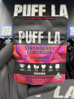 Puff LA Edibles 1000mg THC Cluster Gummies packaging display showing Strawberry Blueberry and Grape flavors