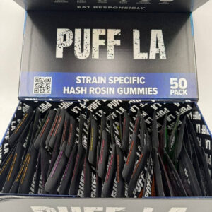 Puff LA Edibles 1000mg THC Cluster Gummies packaging display showing Strawberry Blueberry and Grape flavors