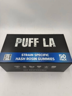 Puff LA Edibles 1000mg THC Cluster Gummies packaging display showing Strawberry Blueberry and Grape flavors